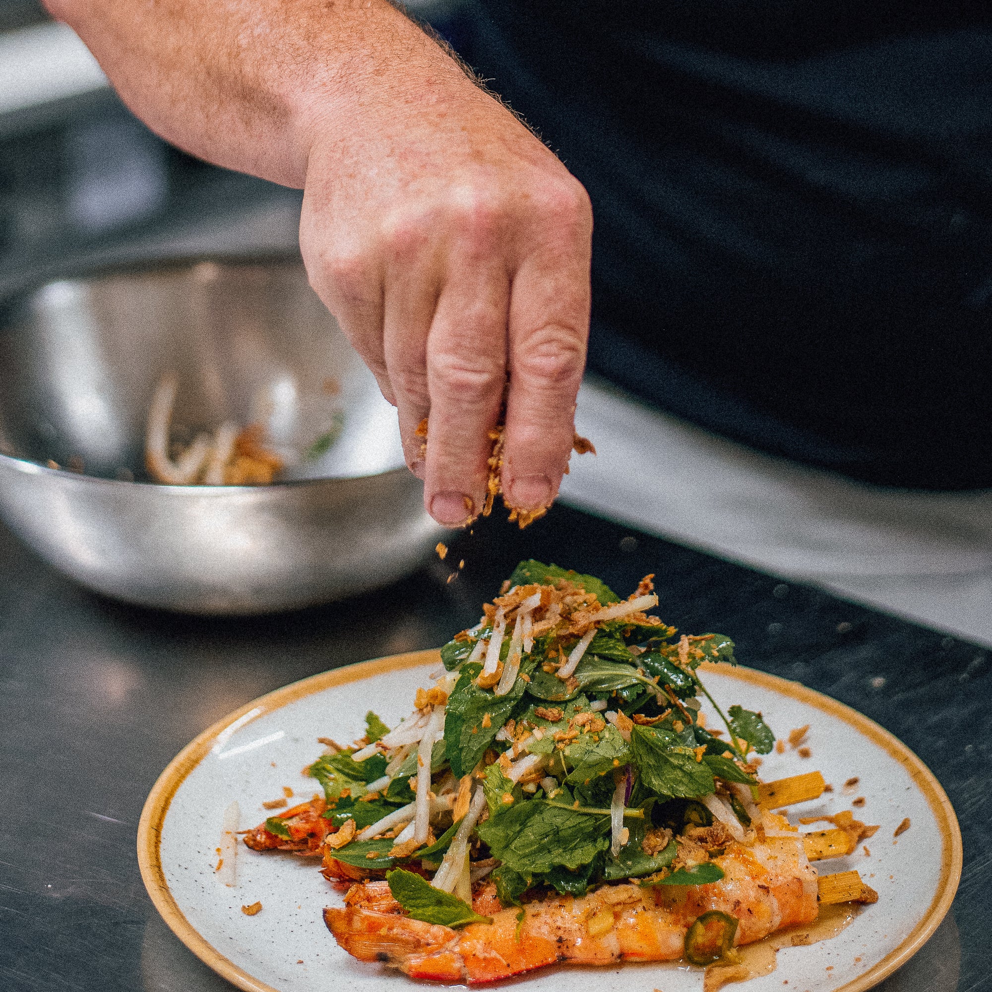 Peter Clarke Garnishing a Dish